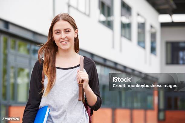 Portrait Of Female Student Standing Outside College Building Stock Photo - Download Image Now