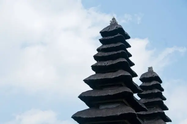 Photo of Two pagoda of Taman Ayun Bali sacred temple with blue sky