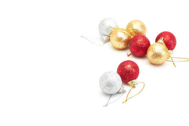 istock beautiful red gold and silver Christmas balls on white 879054074
