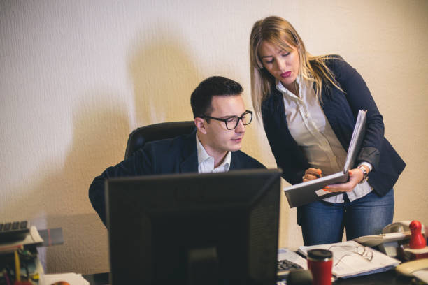 istock Business teamwork - two business partners working together on laptop at workplace 879054340