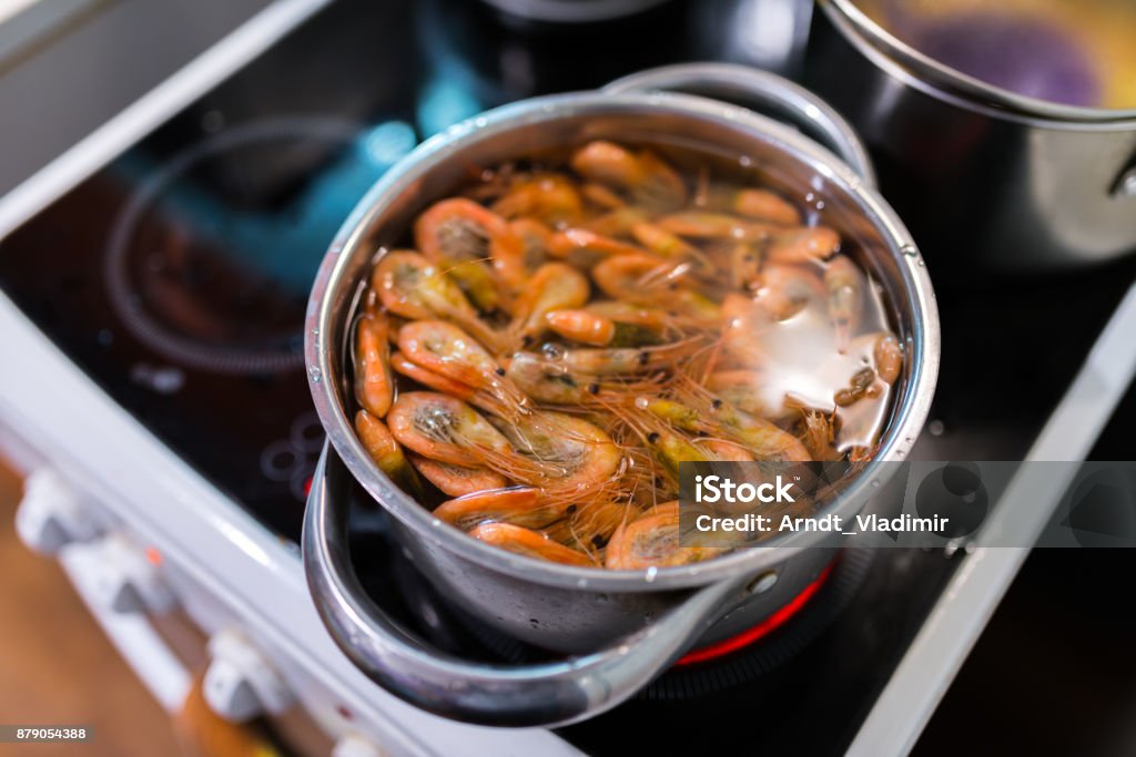 Shrimps boil in pan. Shrimps boil in pan. Selective focus with shallow depth of field. Appetizer Stock Photo