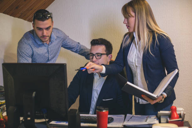 istock Business teamwork - two business partners working together on laptop at workplace 879054544