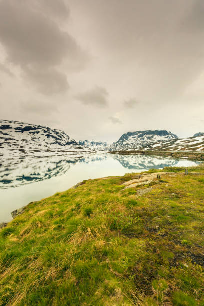 istock Norway scenic mountains with frozen lake. 879057744