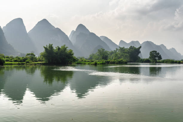 istock Wonderful view of karst mountains reflected in water, Yangshuo 879057872