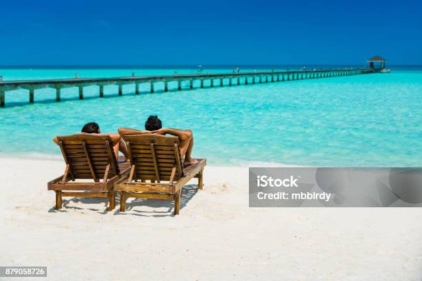 Couple Enjoying Holidays At Dhiffushi Holiday Island Maldives Stock Photo - Download Image Now