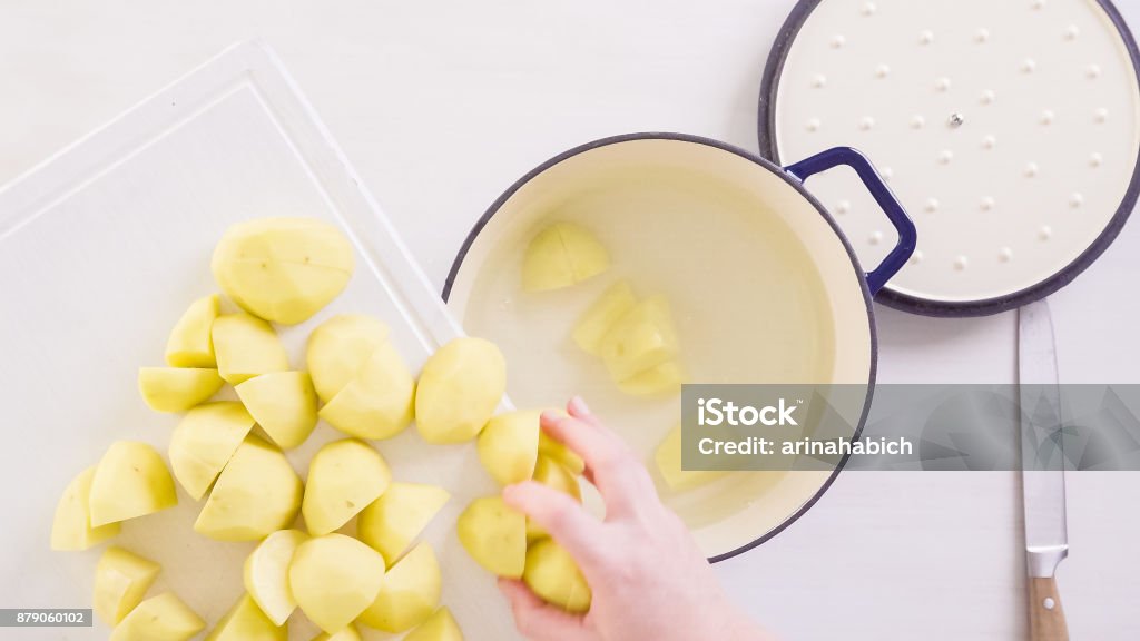 Preparing classic mashed potatoes for Thanksgiving dinner. Step by step. Preparing classic mashed potatoes for Thanksgiving dinner. Cooking Stock Photo