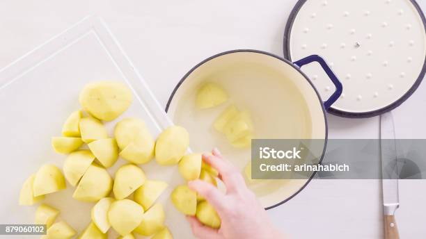 Preparing Classic Mashed Potatoes For Thanksgiving Dinner Stock Photo - Download Image Now
