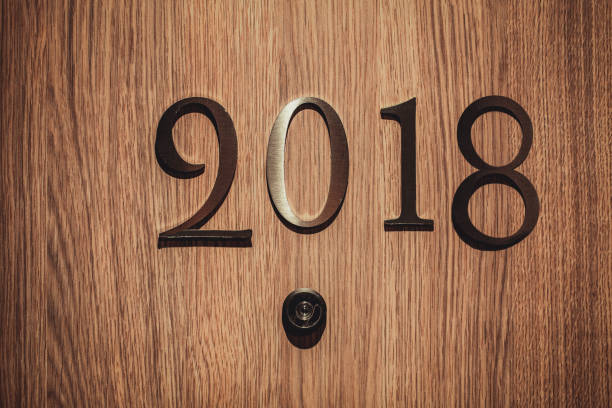 istock Numbers 2018 on hotel door - new year concept background. 879065960