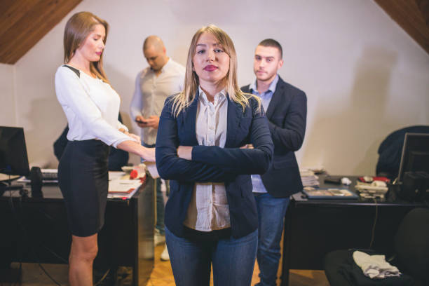 istock Content businesswoman posing while her colleagues are working in office 879068790