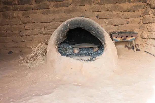 Traditional moroccan  earth oven made out of sandstone in a Berber house in the Sahara desert, Morocco, Africa.