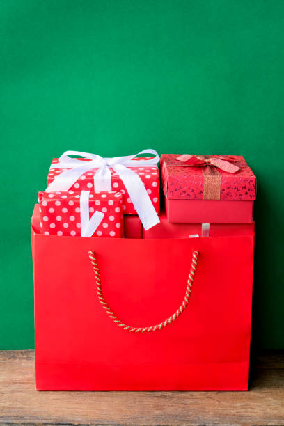 istock christmas and gift boxes and green background 879075852