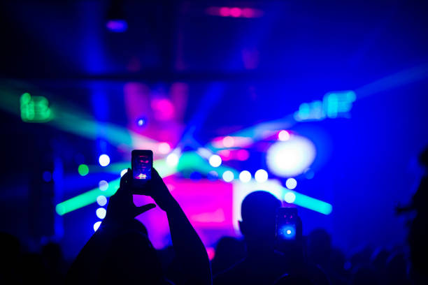 istock Audience recording footage with smartphone during a concert 879079176