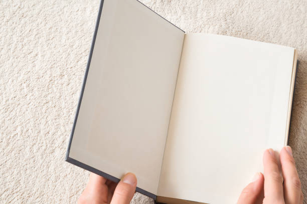 istock Woman reading a opened book in the bed. Reading time. Education concept. Empty place for a text. 879088520