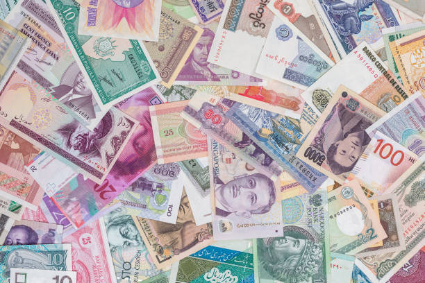 istock world paper money as background. close up 879088902