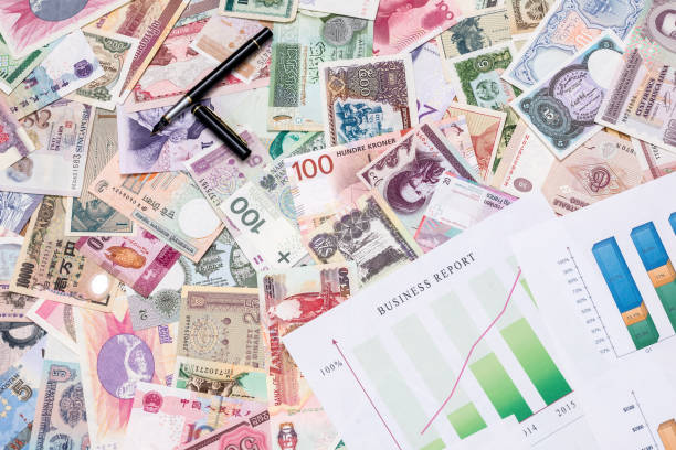 istock business graph with world paper currency 879089096