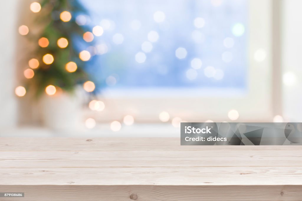 Empty wooden table in front of blurred winter holiday background Christmas Stock Photo
