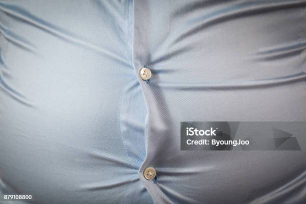 Close Up Of Tight Shirt Fat Mans Upper Body Unsuccessful Dieting And Eating Wrong Foods Diet Concepts Stock Photo - Download Image Now