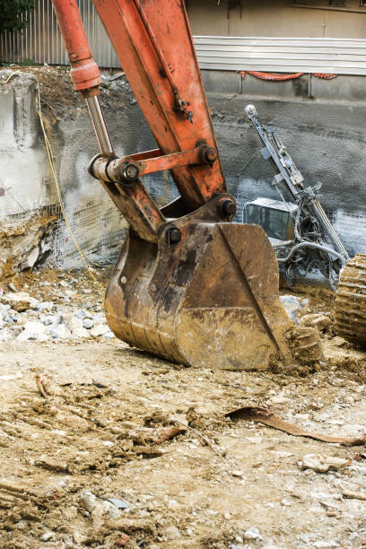 istock Excavator digging mud on construction site in Istanbul, Turkey 879112232