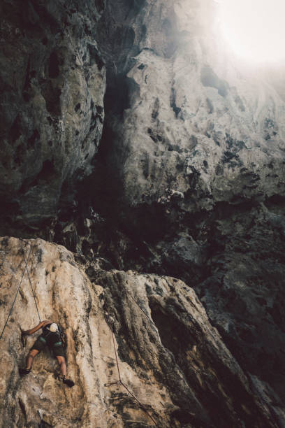istock Female rock climbing at Railay Beach, Krabi, Thailand 879120500