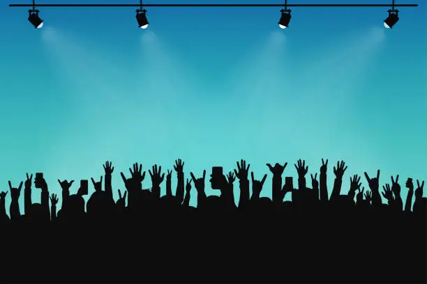 Vector illustration of Concert crowd, people silhouettes. Hands with different gestures and smartphones in raised hands. Spotlights on stage