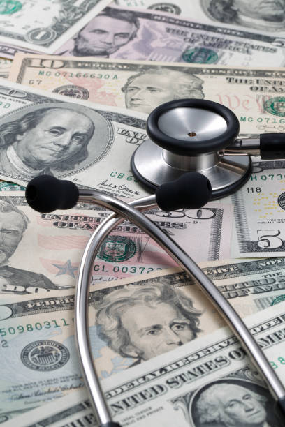 istock medical stethoscope and dollar 879125610