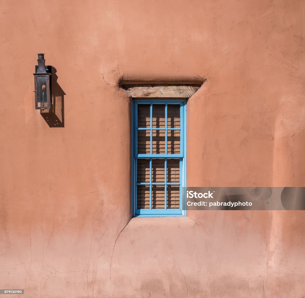 Window in Adobe Home Lantern and window in adobe home in Santa Fe, New Mexico Adobe - Material Stock Photo