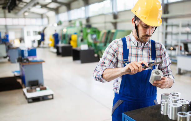Male worker and quality control inspection in factory