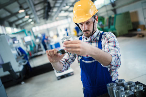 istock Supervisor doing quality control and pruduction check in factory 879133614