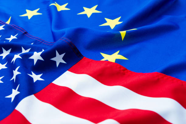 Homemade cupcake with USA and EU flags on white background . The concept of cooperation between countries. The concept of trade relations between countries