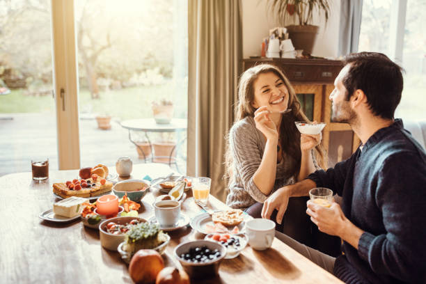 istock happy couple enjoying breakfast together 879134304