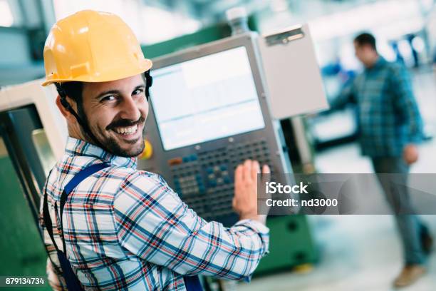 Industrial Factory Employee Working In Metal Manufacturing Industry Stock Photo - Download Image Now