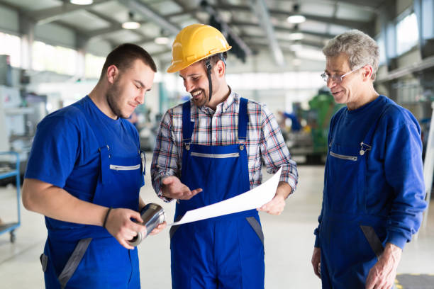 istock Team Of Engineers Having Discussion In Factory 879134784