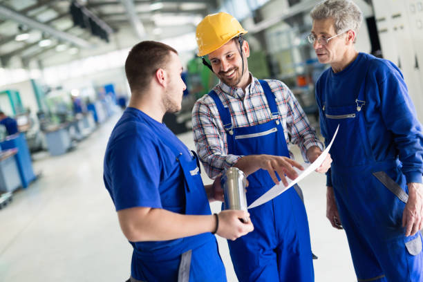 istock Team Of Engineers Having Discussion In Factory 879136928