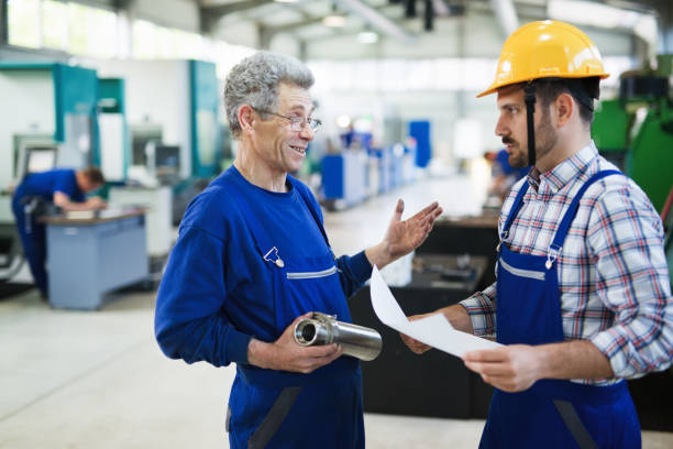istock Team Of Engineers Having Discussion In Factory 879136992