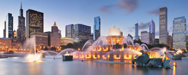 Buckingham Fountain + Skyline at Night - Chicago Panorama of the Buckingham Fountain and the Chicago skyline at night (Chicago, Illinois). grant park stock pictures, royalty-free photos & images