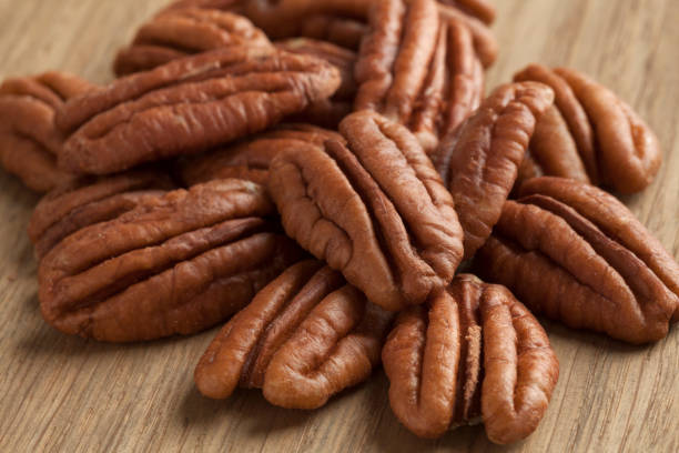istock Heap of pecan nuts close up 879144888