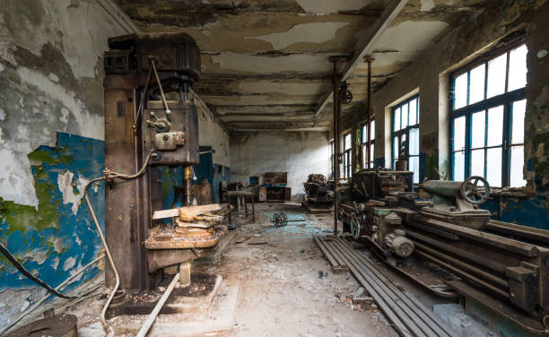istock Old abandoned factory rooms, lathes 879145212