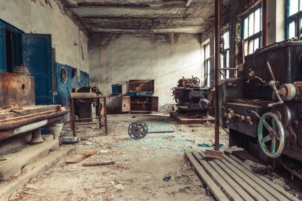 istock Old abandoned factory rooms, lathes 879145436