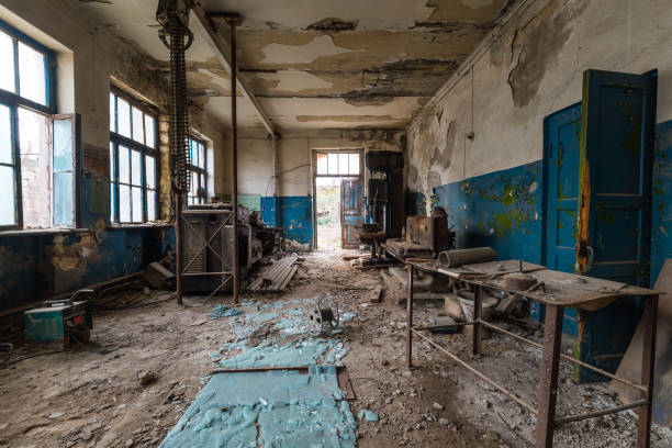 istock Old abandoned factory rooms, lathes 879145694
