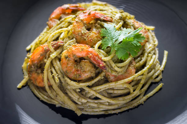 istock Pasta with shrimps and pesto sauce 879146008