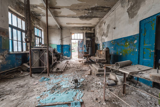 istock Old abandoned factory rooms, lathes 879150618