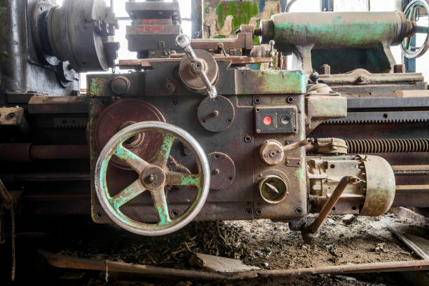 istock Old abandoned factory rooms, lathes 879150816