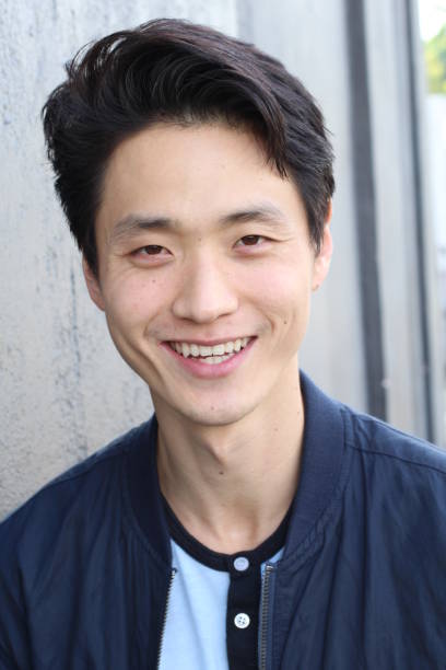 istock Asian man with a perfect white smile 879151236