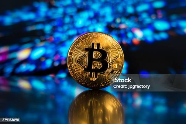 Bitcoin On A Led Technological Light Surface Stock Photo - Download Image Now - Bitcoin, Cryptocurrency Mining, Coin