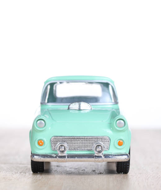 istock miniature car on wooden floor isolated on white background 879153858