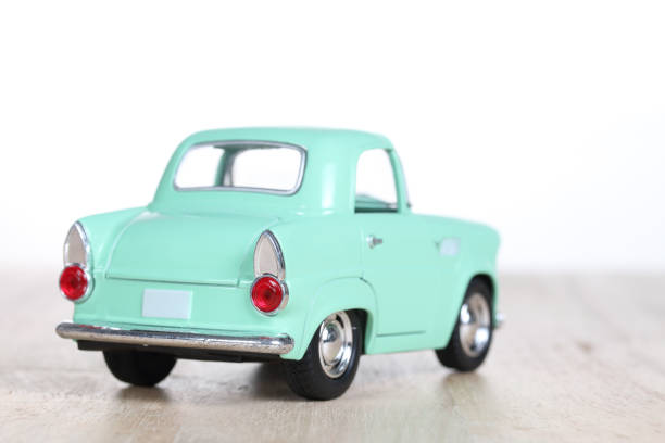 istock miniature car on wooden floor isolated on white background 879153874