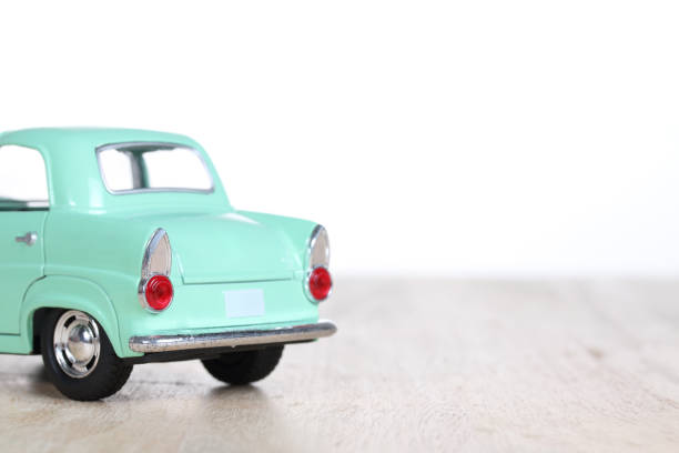 istock miniature car on wooden floor isolated on white background 879153916