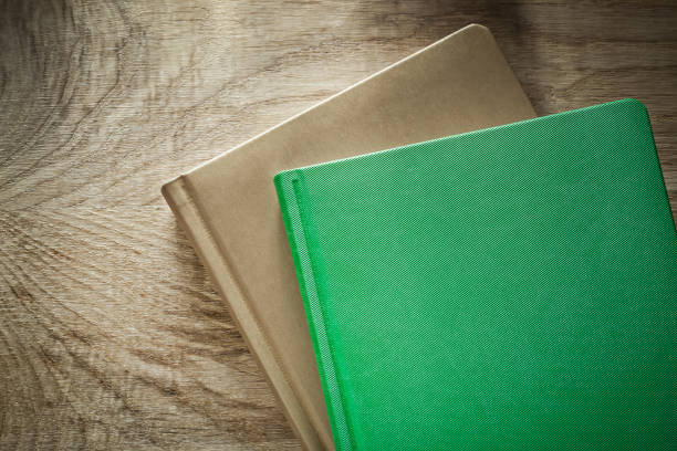 istock Office notebooks on wooden board 879154746