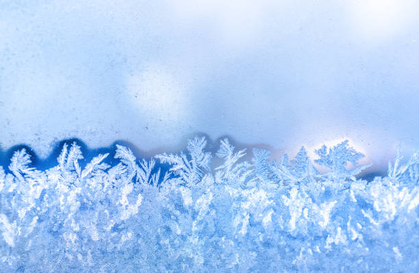 istock blue frost on window festive background, close up 879172018