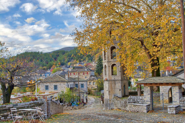 Sunset on a traditional alley in Megalo Papingo village in Ioannina, Greece Sunset on a traditional alley in Megalo Papingo village in Ioannina, Greece on a autumn day zagori stock pictures, royalty-free photos & images